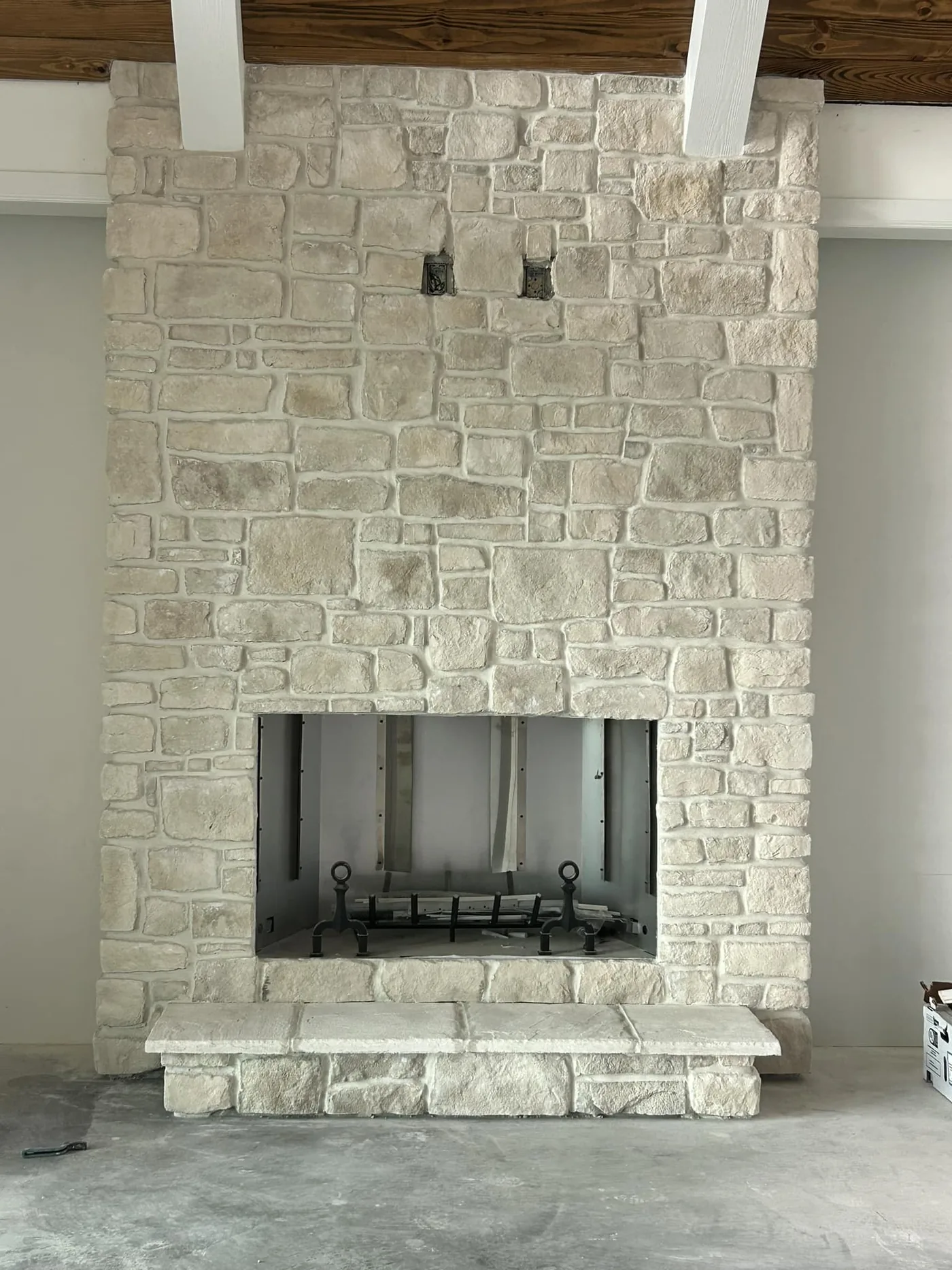 Custom stone fireplace with floor-to-ceiling masonry