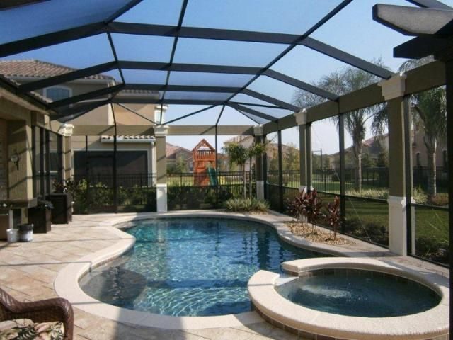Screened pool cage over a residential pool and spa